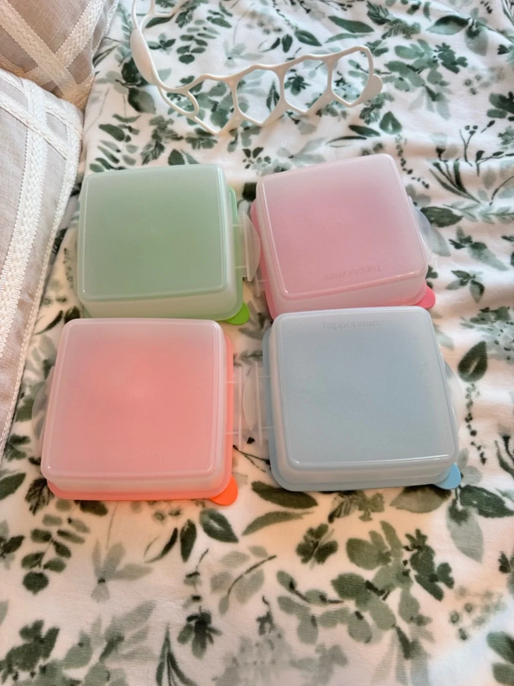 Tupperware Stacked food storage containers with carrier handle